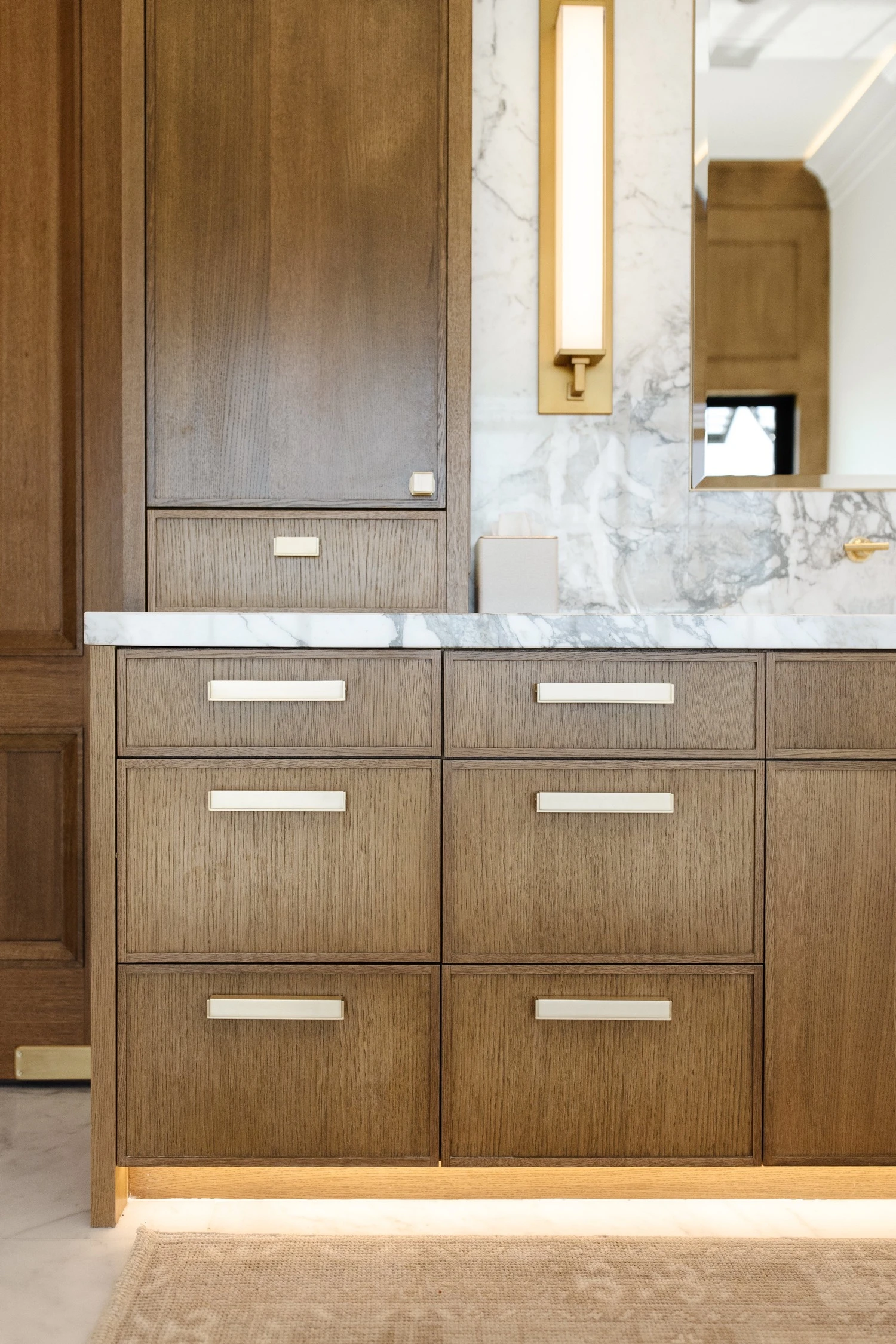 White oak drawer fronts with brass hardware, detail by Warner Cabinets